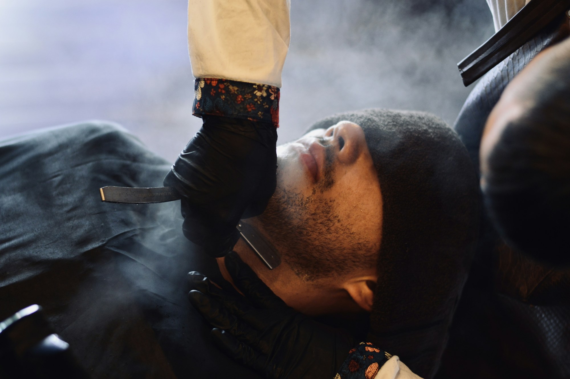 A straight razor shave with steam rising