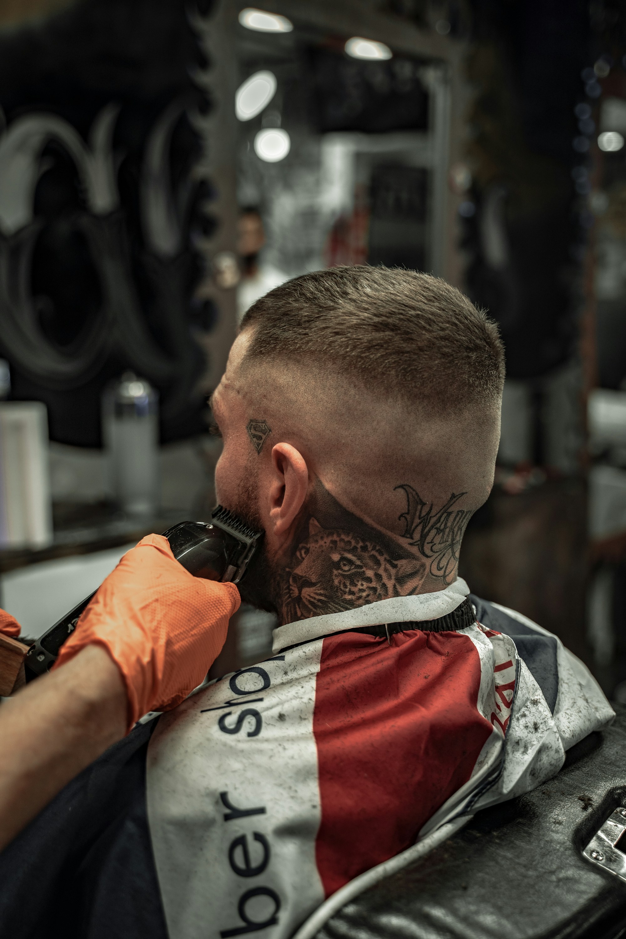 A short taper from behind, with the beard being tidied